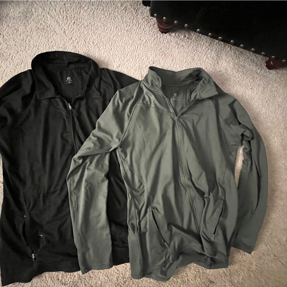 Two women’s athletic zip ups